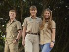 Bindi Irwin, Terri Irwin and Robert Irwin in tree grove.