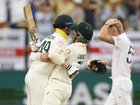 Steve Smith and Marnus Labuschagne celebrate Australia’s win as Ben Stokes looks on.