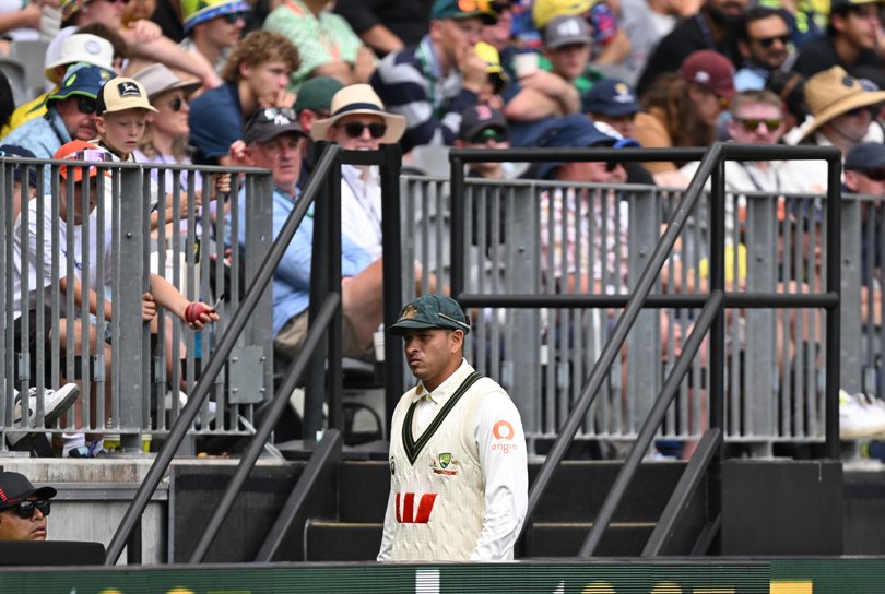 Australia’s Usman Khawaja leaves the field.