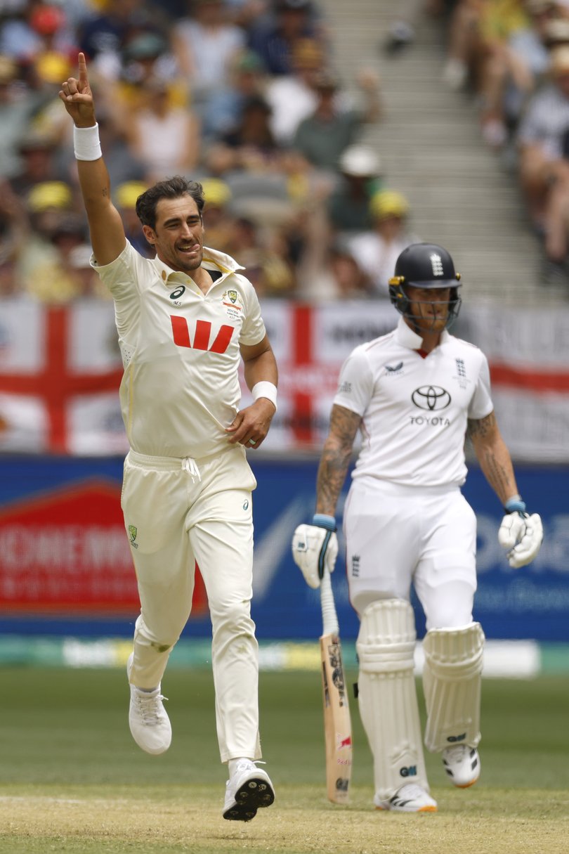 Mitchell Starc celebrates the wicket of Joe Root on Saturday.