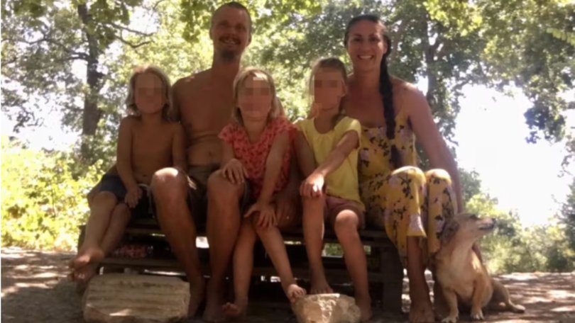 Nathan Trevallion and Catherine Birmingham pose for a picture with their children.