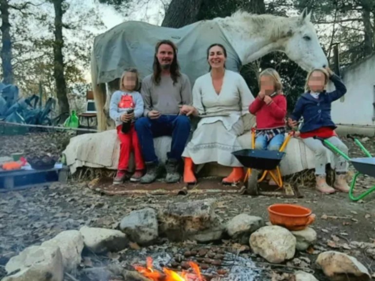 Nathan Trevallion and Catherine Birmingham pose for a picture with their children, who have been removed from their custody following an order from a juvenile court.