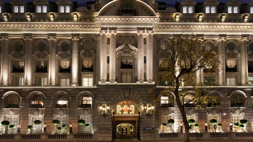 The Chancery Rosewood’s stunning exterior lit up at night.