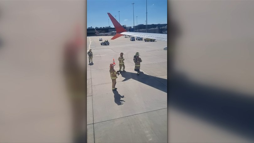 Emergency crews can be seen around the plane. 