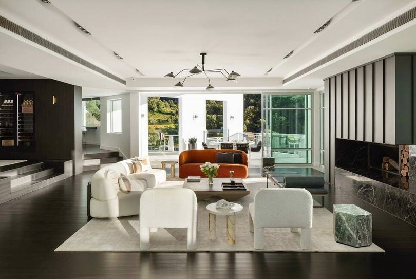 The main living area is centred around a stone fireplace.