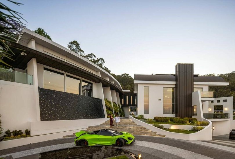 The arrival courtyard has 75,000 hand-laid cobblestones and a garden wall.