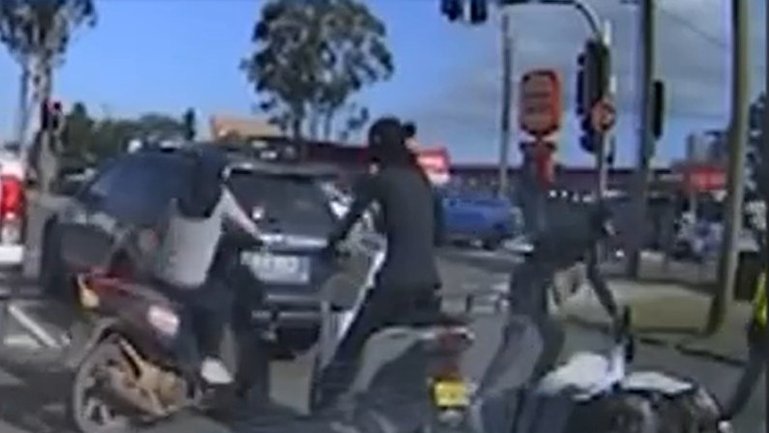 Shocking street ambush leaves delivery rider thrown from bike.