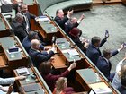 Opposition MPs held up their smartphone torches during the blackout in Federal Parliament.