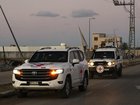 A Red Cross convoy carried the remains of hostage Dror Or after it was handed over by Hamas in Gaza. (AP PHOTO)