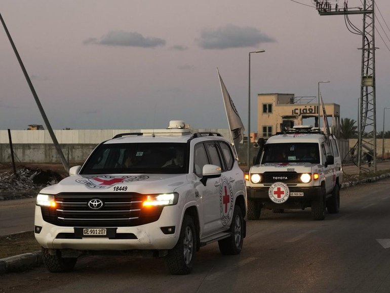 A Red Cross convoy carried the remains of hostage Dror Or after it was handed over by Hamas in Gaza. (AP PHOTO)
