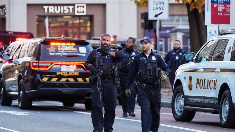 Washington Metropolitan Police are seen after reports of two National Guard soldiers being shot near the White House.