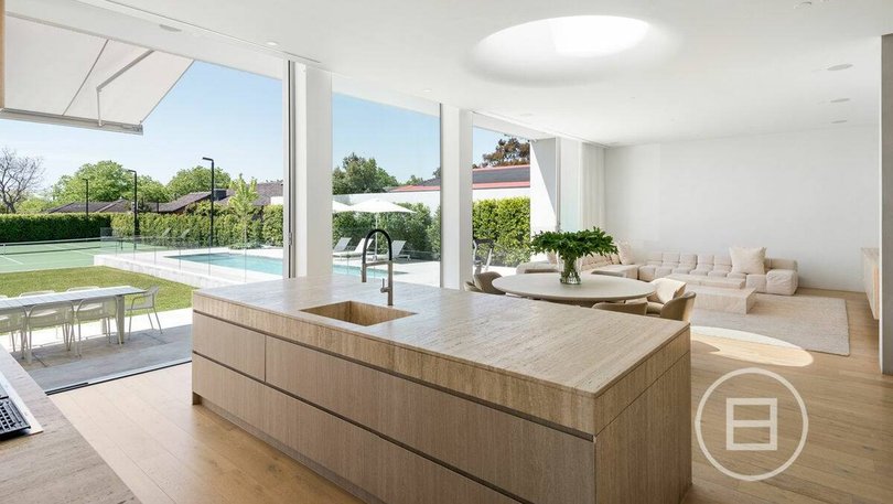 At the end of the home is an open-plan kitchen, living and dining area.