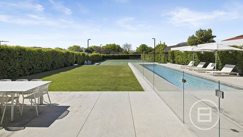 The property features a pool, tennis and basketball court.