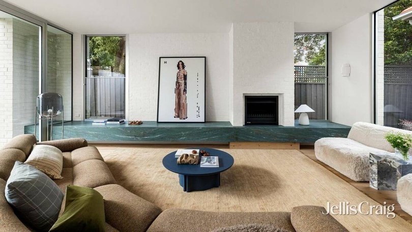 The green marble is repeated throughout the home.