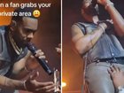 Singer grabbed on stage by female fan.