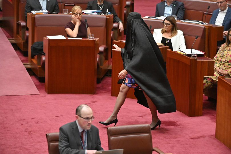 One Nation Leader Pauline Hanson wears a burqa in the Senate chamber at Parliament House.