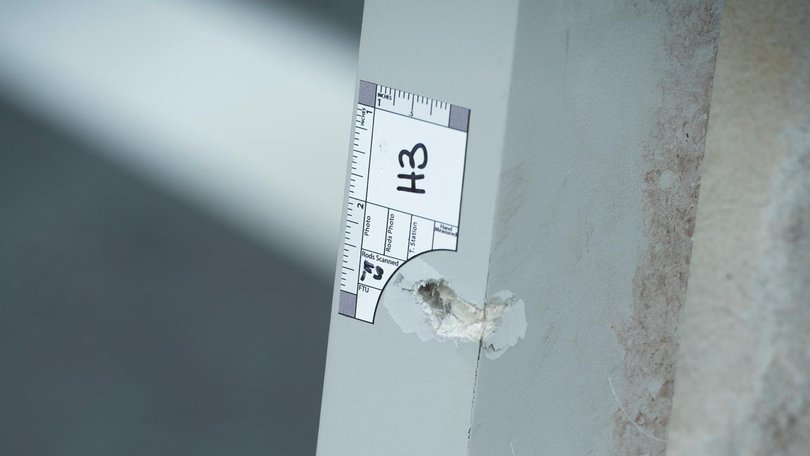 Investigators have marked bullet holes after a man shot two National Guard soldiers. (AP PHOTO)