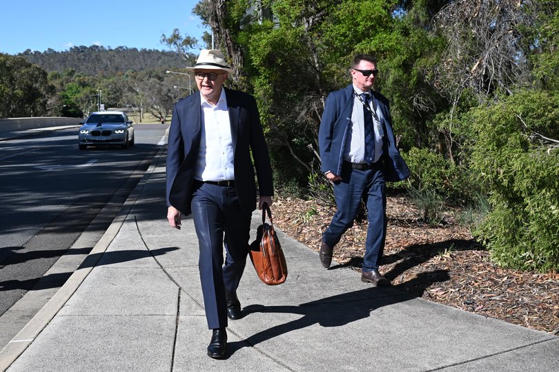 Australian Prime Minister Anthony Albanese arrives walking to his office at Parliament House in Canberra, Friday, November 28, 2025 (AAP Image/Lukas Coch) NO ARCHIVING