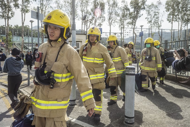 Firefighters arrive at the scene of the fire at the Wang Fuk Court complex.