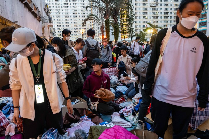 People look through donated items for residents displaced by the fire at Wang Fuk Court in the Tai Po district of Hong Kong, Nov. 27, 2025.