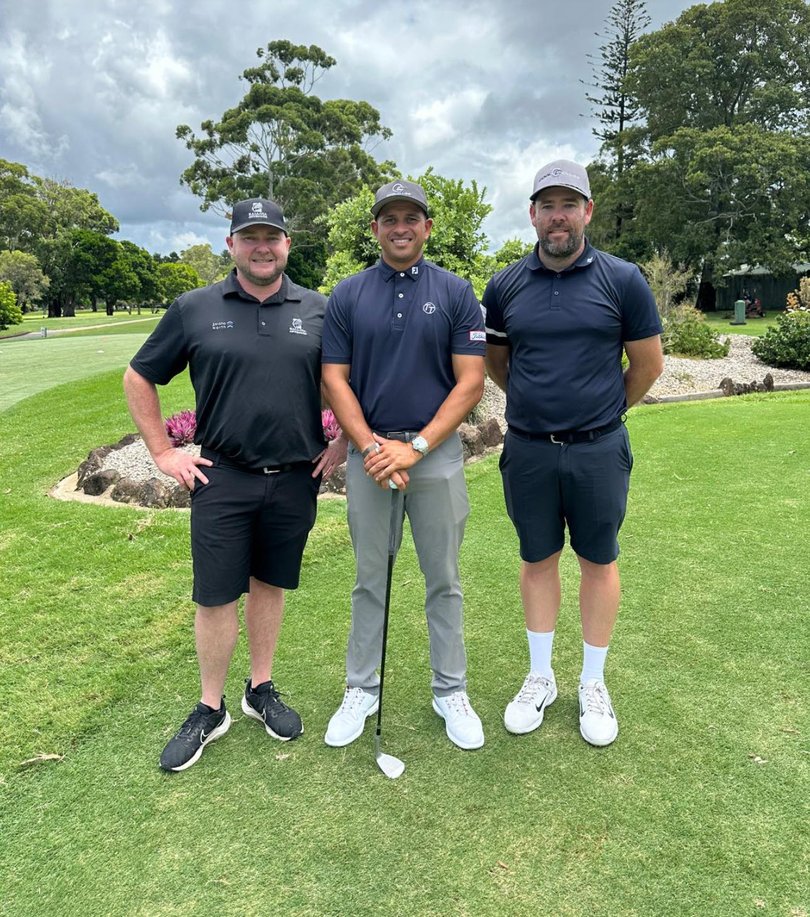 Usman Khawaja (c) loves hitting the links.