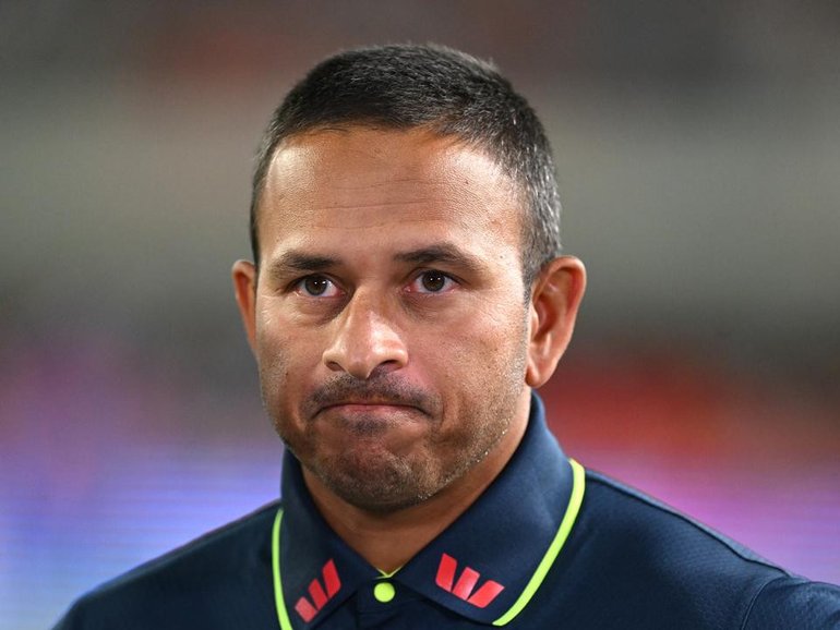 Usman Khawaja is expecting to overcome a back injury and play without painkillers in Brisbane. (Dave Hunt/AAP PHOTOS)