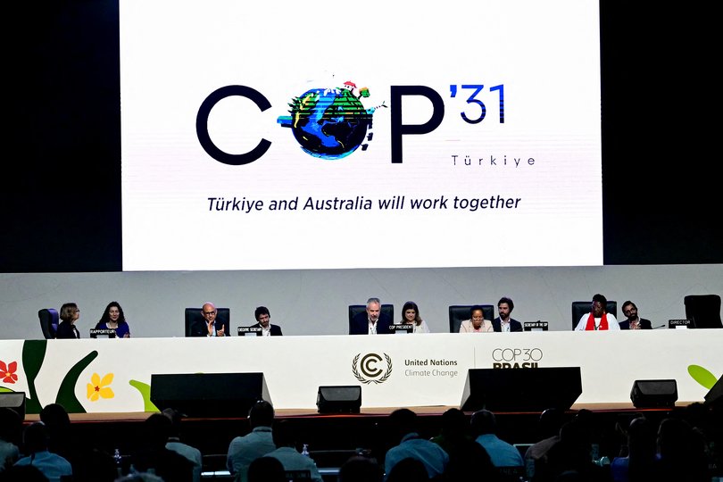 A screen shows the COP31 logo organized by Turkey and Australia during the COP30 UN Climate Change Conference in Belem, Para state, Brazil on November 22, 2025. (Photo by Pablo PORCIUNCULA / AFP)