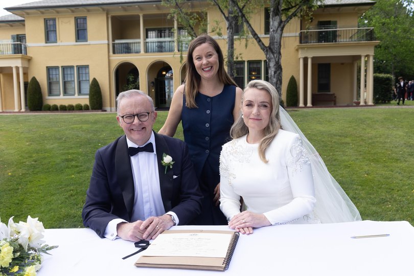 The Prime Minister Anthony Albanese and Jodie Haydon sign the marriage certificate with celebrant Bree after getting married today in Canberra.Photograph by Mike Bowers Picture: Mike Bowers