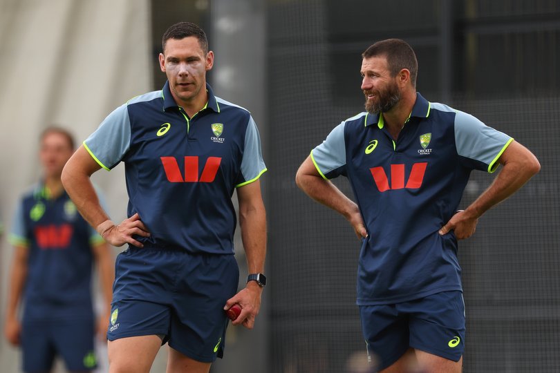 Scott Boland and Michael Neser look on during an Australia nets session at Perth Stadium.