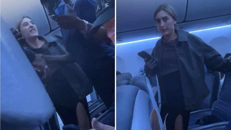 A furious airline passenger erupted into a profanity-laced tirade after being stuck on the tarmac for more than an hour.
