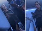 A furious airline passenger erupted into a profanity-laced tirade after being stuck on the tarmac for more than an hour.