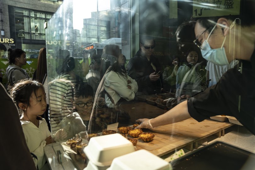 A Staff member prepares the display counter in Naisnow in the Flushing neighbourhood of Queens.