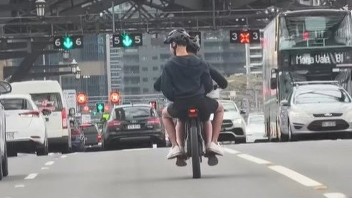 The unbelievable moment e-bike riders crossed the Sydney Harbour Bridge.