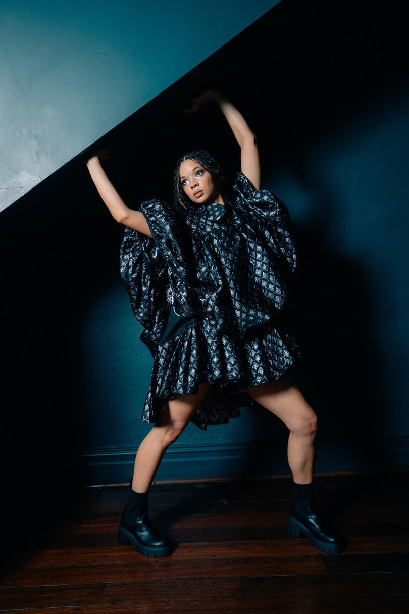 Tanzyn is pictured at Guildhall in North Fremantle wearing a Monique Tuffnell set with Mountain and Moon Demi earrings and BETTS Chloe boots.