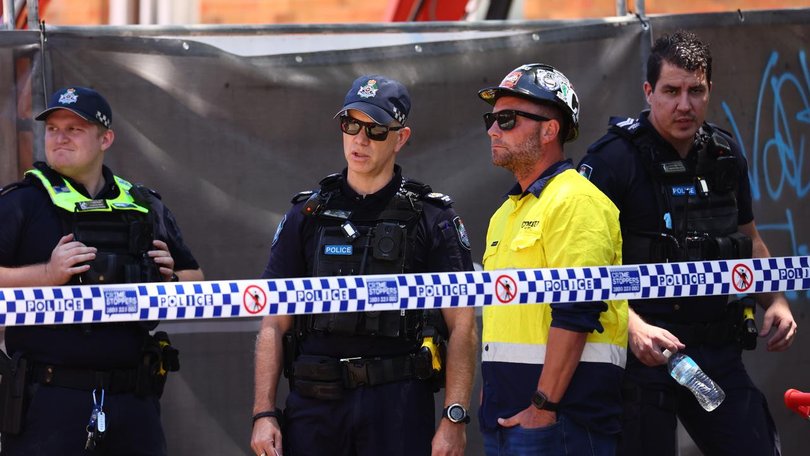 Emergency crews spent more than an hour carefully removing a teenager from under a collapsed wall. (Jason O'BRIEN/AAP PHOTOS)