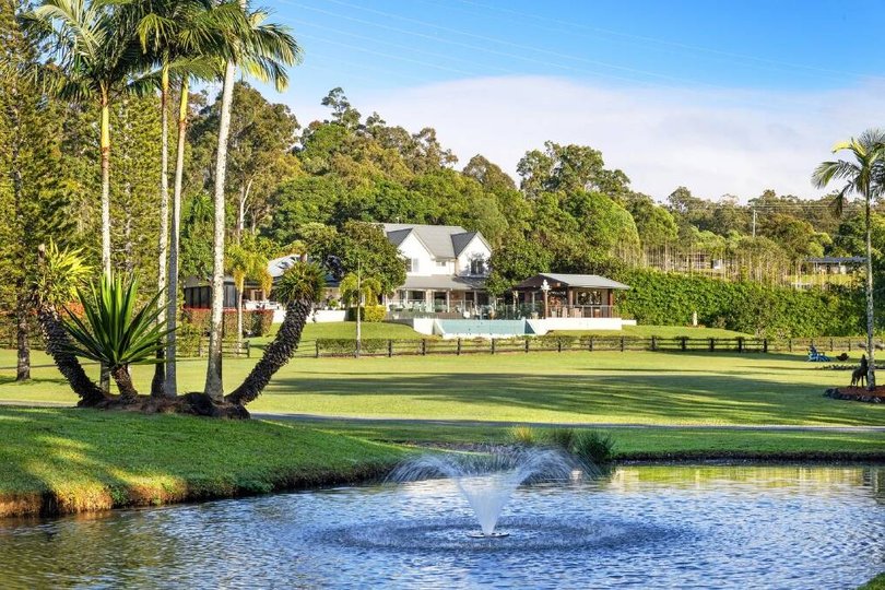 The acreage has lawns, established trees and landscaped gardens.