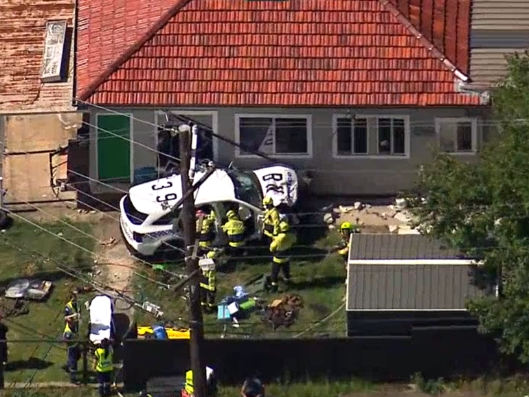 A police car has crashed into a house in Western Sydney.