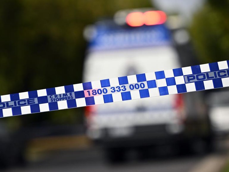 Police opened fire on a man who shot at them with a crossbow.