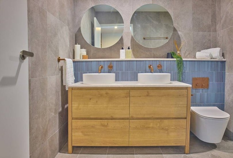 Bathrooms feature bronze fixtures.