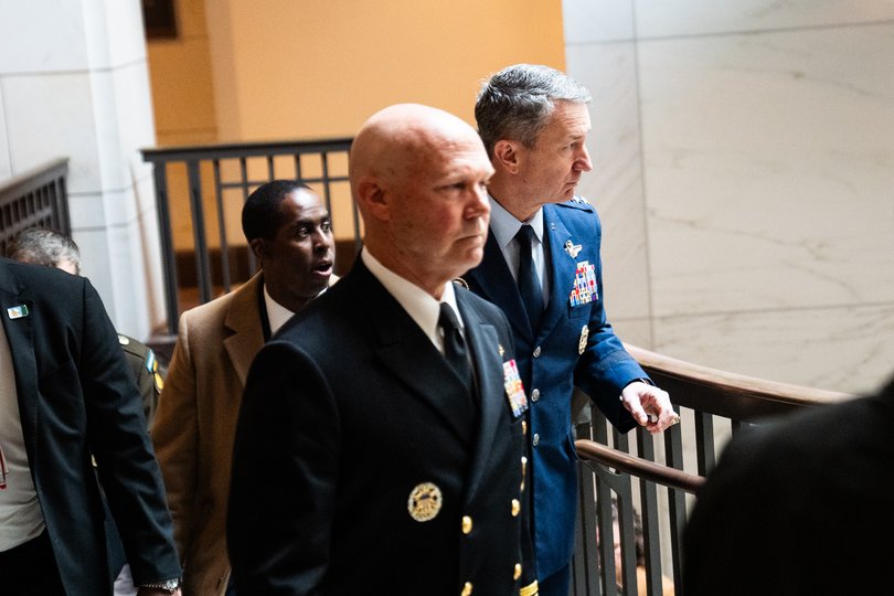 Gen. Dan Caine, right, chairman of the Joint Chiefs of Staff, escorts Navy Admiral Frank M. Bradley to the meeting with lawmakers. 