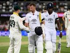 Joe Root of England shakes hands with Australia captain Steve Smith as he leaves the field at stumps
