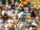 BRISBANE, AUSTRALIA - DECEMBER 05: Jake Weatherald of Australia raises his bat after scoring 50 runs during day two of the Second 2025/26 Ashes Series Test Match between Australia and England at The Gabba on December 05, 2025 in Brisbane, Australia. (Photo by Darrian Traynor/Getty Images)