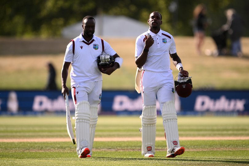 CHRISTCHURCH, NEW ZEALAND - DECEMBER 06: Kemar Roach and Justin Greaves of the West Indies walk from the pitch following day five of the First Test match in the series between New Zealand and West Indies at Hagley Oval on December 06, 2025 in Christchurch, New Zealand. (Photo by Joe Allison/Getty Images)