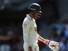 Alex Carey of Australia leaves the field after being dismissed.