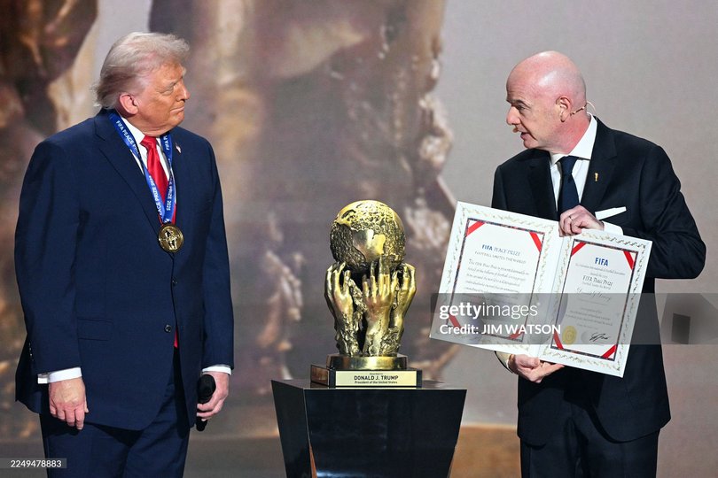US President Donald Trump receives the FIFA Peace Prize from Italian Fifa President Gianni Infantino.