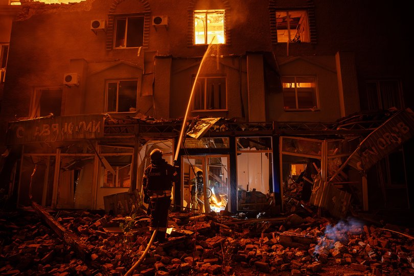 Firefighters respond as a building burns following a Russian drone attack on Sloviansk, Ukraine, on Oct. 8, 2025. 