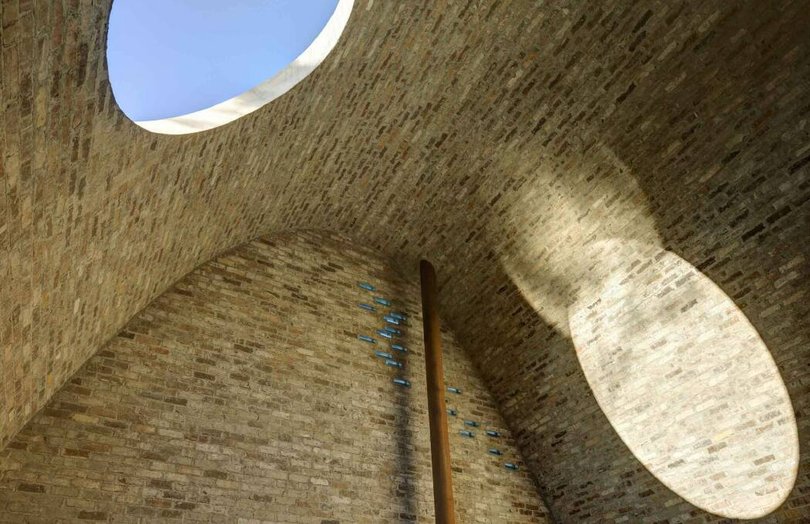 The oculus becomes a monumental skylight where the sun casts an ever-moving arc across the floors and walls.