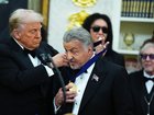 US President Donald Trump presents actor Sylvester Stallone with a medal as part of the 2025 Kennedy Center Honours.