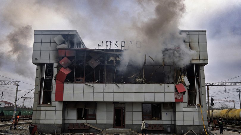 Smoke rises from a heavily damaged train station building in the town of Fastiv, Kyiv region, after an air attack, on December 6, 2025.