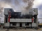 Smoke rises from a heavily damaged train station building in the town of Fastiv, Kyiv region, after an air attack, on December 6, 2025.